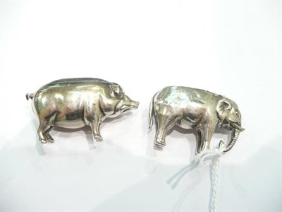 Lot 247 - Silver pig pin cushion and an elephant silver pin cushion