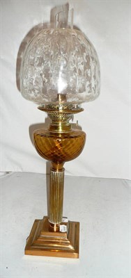 Lot 278 - Brass oil lamp with amber tinted reservoir