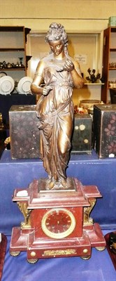 Lot 281 - A red marble and spelter striking mantel clock