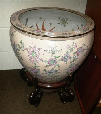 Lot 320 - Chinese pottery fish bowl on a hardwood stand