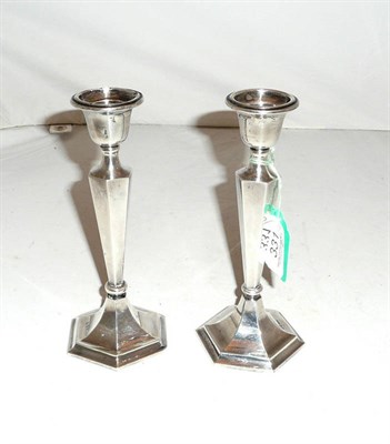 Lot 331 - A pair of loaded silver candlesticks (2)