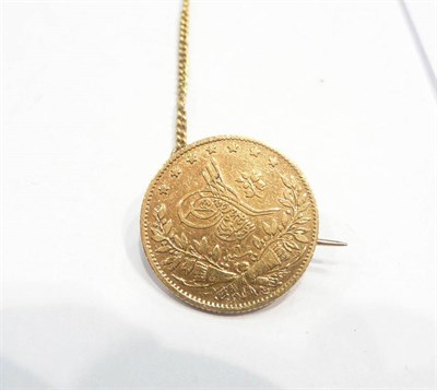 Lot 359 - An Arabic coin mounted as a brooch