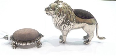 Lot 364 - Silver tortoise pin cushion and a silver plated lion pin cushion