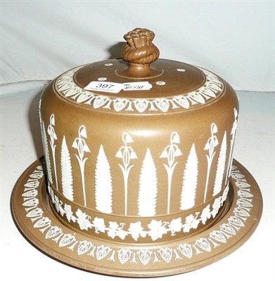 Lot 397 - Stoneware cheese dome and stand with floral relief decoration