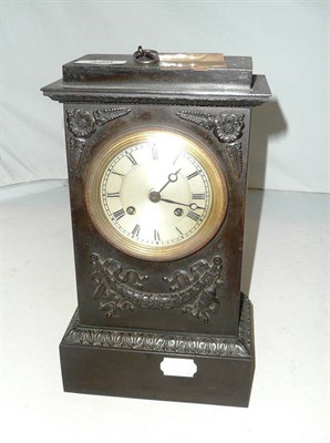 Lot 398 - Mantel clock in a relief-decorated bronzed case