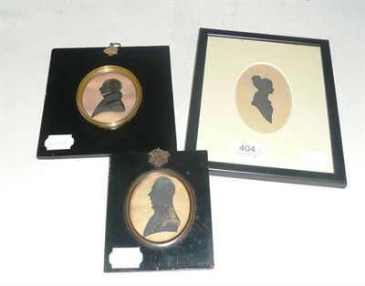 Lot 404 - An oval portrait silhouette, painted by J Newton of Grafton Street, Dublin and two others