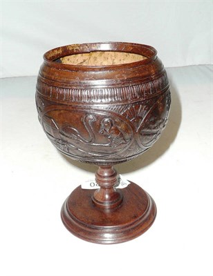 Lot 420 - Coconut cup carved with animals on a later pedestal stand