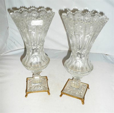 Lot 425 - Pair of cut glass pedestal vases on gilt metal square stands