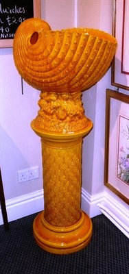 Lot 463 - Burmantofts yellow glaze shell shaped jardiniere and a similar pedestal stand