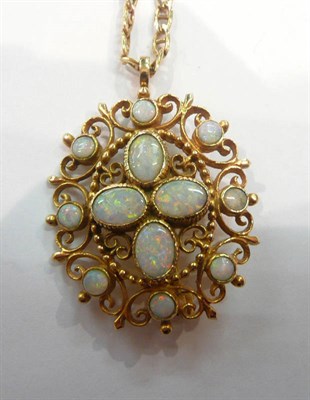 Lot 477 - An opal gold brooch/pendant