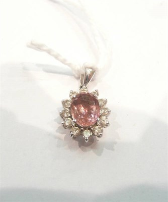 Lot 486 - Pink sapphire and diamond pendant with card report