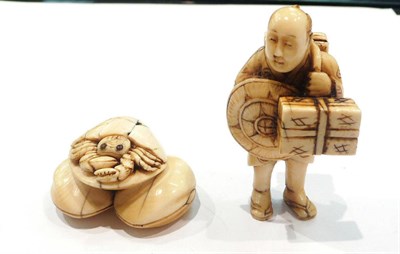 Lot 490 - Japanese netsuke as a peasant carrying boxes and another as a crab and shells, both circa 1900