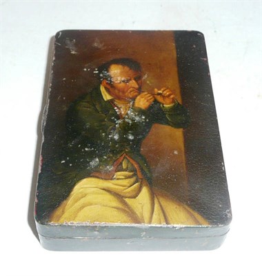 Lot 517 - A painted tin tobacco box