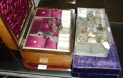 Lot 533 - A jewellery box with contents including a buckle bangle, a silver shield on an Albert, and two...