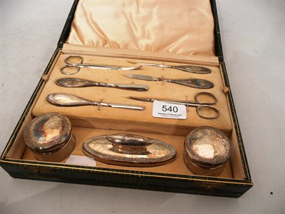 Lot 540 - A silver handled nine piece manicure set, cased