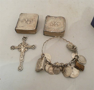 Lot 558 - Bangle with charms, two prayer books, and a crucifix