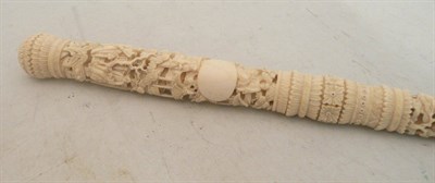 Lot 589 - A carved ivory parasol handle