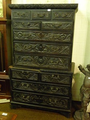 Lot 730 - Dark oak and heavily carved chest on chest