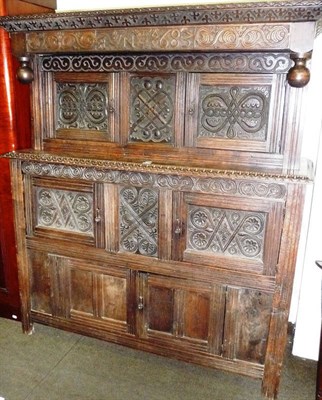 Lot 744 - 17th century style carved oak court cupboard