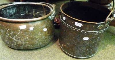 Lot 771 - A copper cauldron with swing handle and a copper log bucket