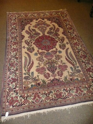 Lot 863 - Persian rug on cream field