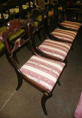 Lot 865 - Set of four simulated rosewood sabre-legged chairs