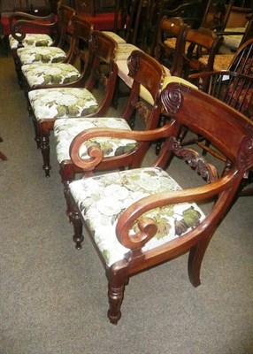 Lot 869 - Set of six William IV mahogany dining chairs with green floral seats (including two carvers)