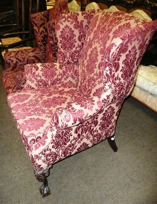 Lot 871 - Early Georgian-style wing back chair upholstered in red floral fabric