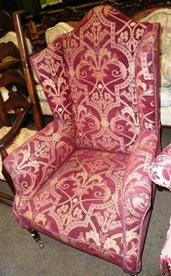 Lot 872 - Small Regency-style wing back chair raised on casters