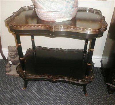 Lot 884 - Pair of 19th century ebonised and parcel gilt etagere with brass galleries