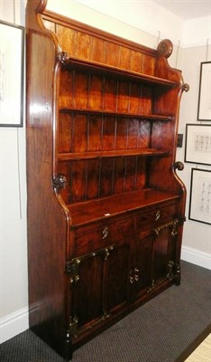 Lot 897 - A late 19th century pitch pine dresser with brass metal mounts