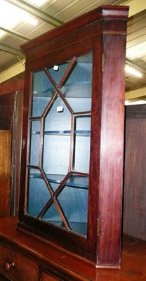 Lot 949 - A George III mahogany glazed hanging corner cupboard