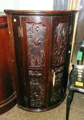 Lot 956 - 19th century carved oak hanging corner cupboard