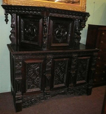 Lot 961 - Heavily carved Flemish style court cupboard