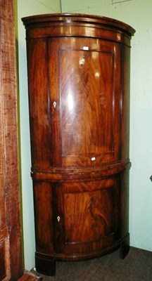 Lot 962 - 19th century Continental mahogany free standing corner cupboard