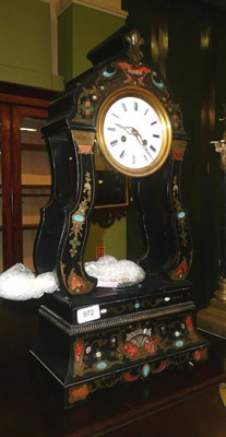 Lot 972 - An ebonised inlaid striking mantel clock