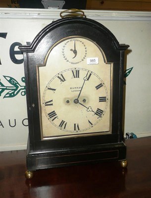 Lot 985 - An ebonised striking mantel clock