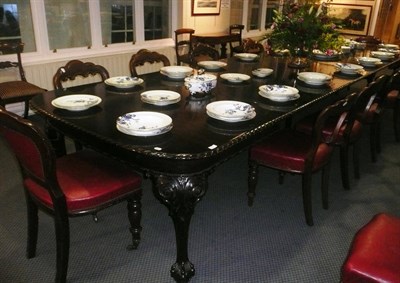 Lot 990 - 1930's mahogany dinning table with five extra leaves