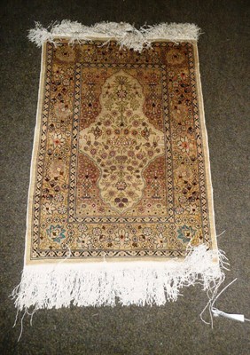 Lot 993 - Hereke Silk Rug, North West Anatolia, the cream field of flowering plants framed by urns...