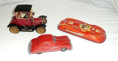 Lot 1049 - Three Tinplate Cars:- Schuco clockwork Ford Coupe T 1917 with key, in red and black; Schuco...