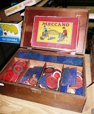 Lot 1053 - A Collection of Meccano, including gold, blue & gold check, red wheels and cogs, all in a large...