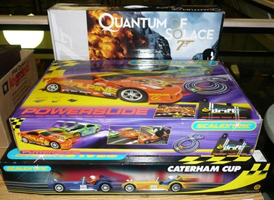 Lot 1071 - Three Boxed Scalextric Sets - Quantum of Solace Set C1220, Caterham Cup Set C1034, Powerslide...