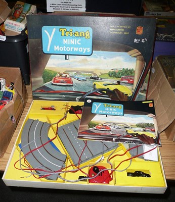 Lot 1080 - A Boxed Tri-ang Minic Motorway Set M1504, containing two cars, track, controllers and manual