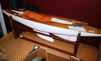 Lot 1085 - A Wooden Racing Pond Yacht, with white painted hull, lead keel, steering quadrant, mast and...