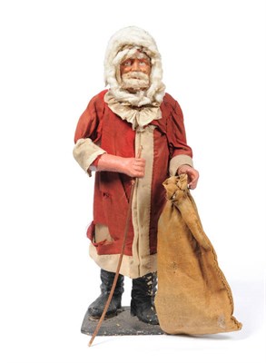 Lot 1086 - A Father Christmas Clockwork Automaton, with nicely moulded composition head, arms and boots,...