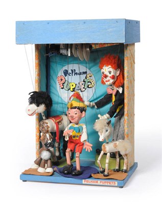 Lot 1087 - An Electrically Operated Wooden Pelham Puppet Shop Window Display, containing five puppets - Clown