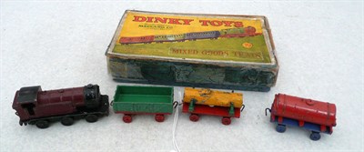 Lot 1142 - A Boxed Dinky Pre-War Mixed Goods Train Gift Set No.19, with maroon and black locomotive, green and