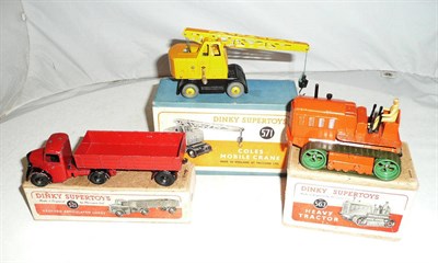 Lot 1144 - Three Boxed Dinky Supertoys:- Bedford Articulated Lorry No.521, with red body, black wings and...