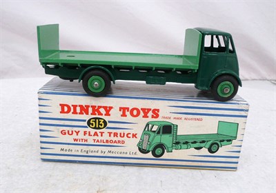 Lot 1145 - A Boxed Dinky Guy Flat Truck with Tailboard No.513, 1st type cab, with dark green cab &...