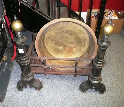 Lot 1586 - An impressive cast iron dog basket and irons and a brass circular bowl